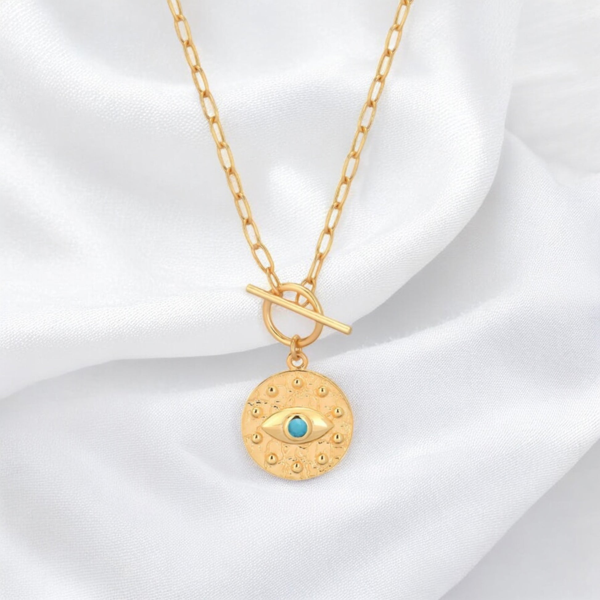 luxury evil eye pendant necklace crafted in gold plated sterling silver with gemstone details Gem Karageorgiou jewellery